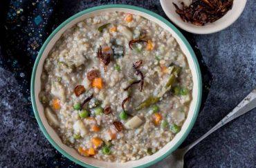 Bowl of kuttu ki khichadi with boiled potatoes and roasted peanuts, a Navratri vrat recipe from Indian Foods.